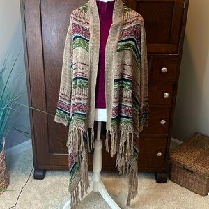 Long boho open front cardigan SZ SM but runs big. Tapered bottom with fringe